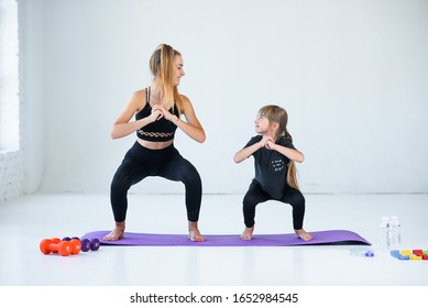 children practicing are engaged in gymnastics and yoga with teacher