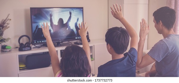 Children praying with father, family and kids fellowship worshiping online together at home, digital streaming church service, social distancing, lockdown concept - Shutterstock ID 1737732773