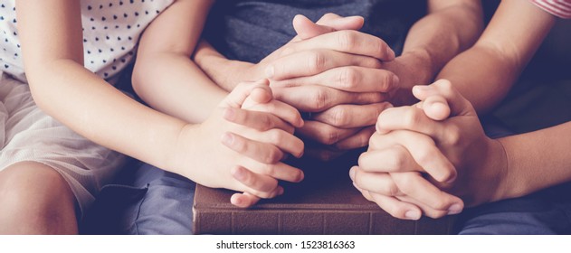 children praying with parent at home, family pray together, online group worship, World Day of Prayer,international day of prayer, hope, gratitude, thankful, trust - Shutterstock ID 1523816363