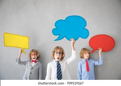 Children Pretend To Be Businessman. Business Team Of Kids. Child Playing At Home. Imagination, Idea And Successful Teamwork Concept. Colored Paper Speech Bubbles With Copy Space For Your Text