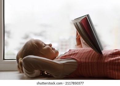 Children Reading. Little Girl Child Read Book In Window Sill. Kids Love To Reading. World Book Day