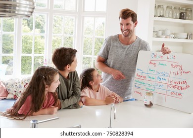 Children Receiving Pocket Money After Completing List Of Chores