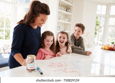 Children Receiving Pocket Money After Completing List Of Chores