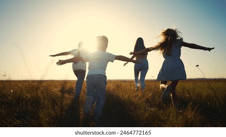 The children run play in forest. happy family kid dream concept. The children running in the park silhouettes. children kid running across the field group in park silhouette at lifestyle sunset - Powered by Shutterstock