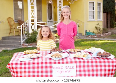 Children Running Charity Bake Sale