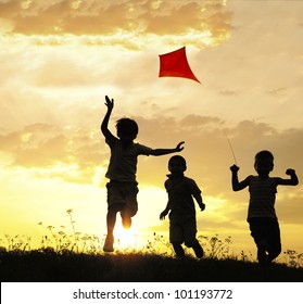 Children Running With Kite