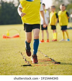 Children Running On Ladder Training Drill. Beginner Football Agility Ladder Drills. Happy Kids On Sports Summer Camp