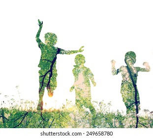 Children Running On Meadow At Sunset