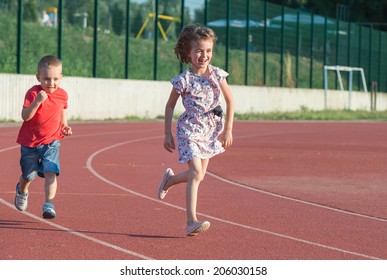 Children Running On The Track