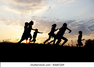 Children Running Outdoor, Night, Summertime