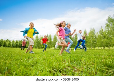 Children Are Running Through Green Field Together