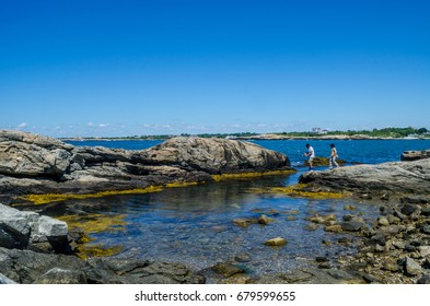 Children Seen Fishing At Newport Cliff Walk