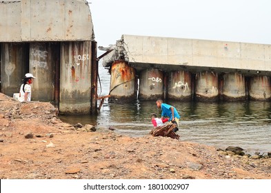 Children Is Seen In Front Of Broken Sea Barrier As Impact From The Sea Level Rising In Jakarta, Indonesia, May 28, 2020.