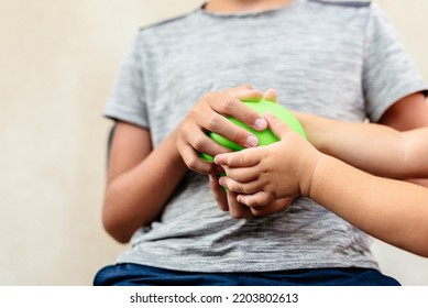 Children Sharing Toy Ball Squish. Brother And Sister Don't Sharing.