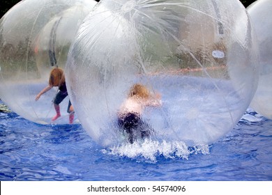 Children in soap bubbles floating on the water