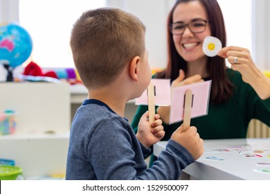 Children Speech Therapy Concept. Preschooler Practicing Correct Pronunciation With A Female Speech Therapist.