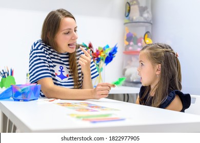 Children Speech Therapy Concept. Preschooler Practicing Correct Pronunciation With A Female Speech Therapist. 