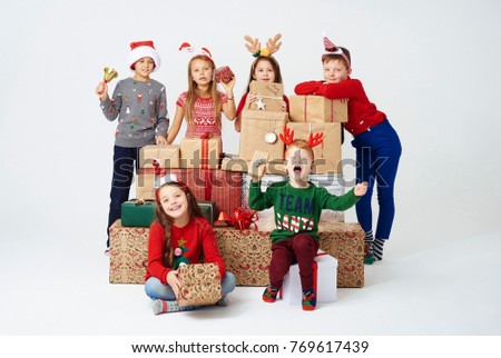 Children and stack of christmas present