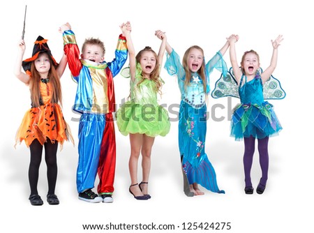 children stand holding hands and lifting them up and shout