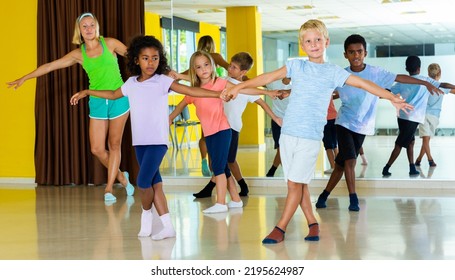 Children Studying Of Partner Dance At Dance School. High Quality Photo