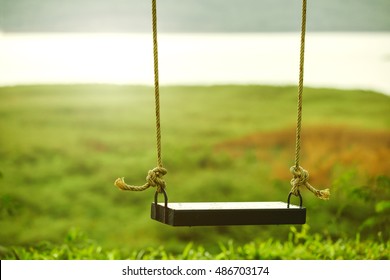 Children swing in the park - Shutterstock ID 486703174