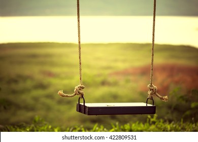 Children swing in the park (vintage tone) - Shutterstock ID 422809531