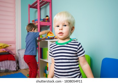 The Children Take Turns Playing With Toys In The Kindergarten