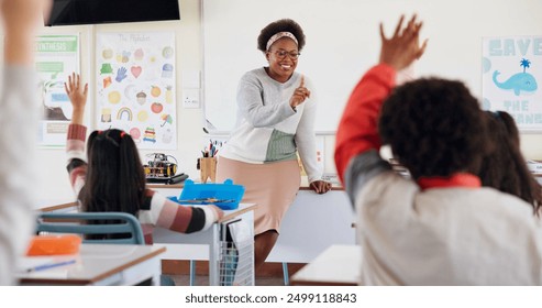 Children, teacher and hands raised at school for questions, answer and learning at youth academy. Kids, education and woman for development with sign for talking, quiz and scholarship in classroom - Powered by Shutterstock