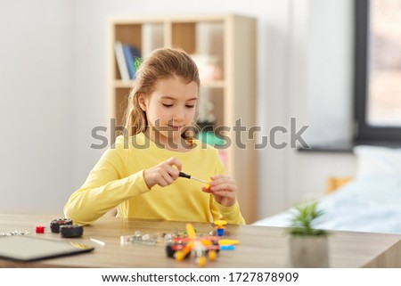 Similar – Image, Stock Photo Little girl playing in a home playground