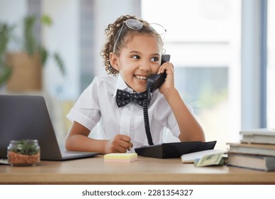 Children, telephone and a girl playing in an office as a fantasy businesswoman at work on a laptop. Kids, phone call and a female child working at a desk while using her imagination to pretend - Powered by Shutterstock