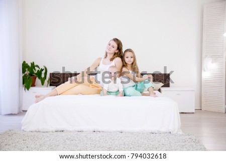children of three sisters in the morning on the bed in the bedroom