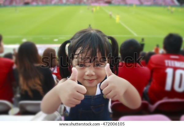 children thumb finger show for cheer football or\
soccer at stadium, fan\
club