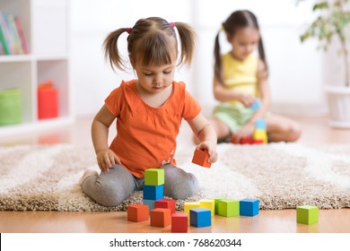 Children Toddlers Girls Play Toys At Home, Kindergarten Or Nursery.