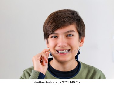 Children Tooth Care And Hygiene. Portrait Of A Teenager Boy With Diastema Overbite Teeth Missing Gap Wearing Orthodontic Appliance Treatment. Dental Braces With Child Concept.