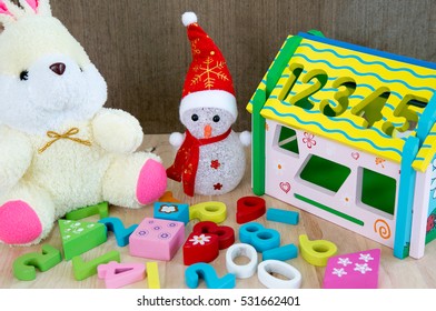 Children toy with doll and smowman, Brain development for children.