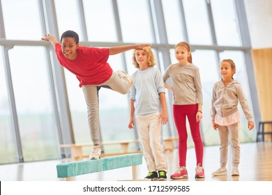 Children Train In The Physical Education On The Balance Beam The Coordination