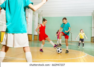 Children Training Football In School Sports Hall