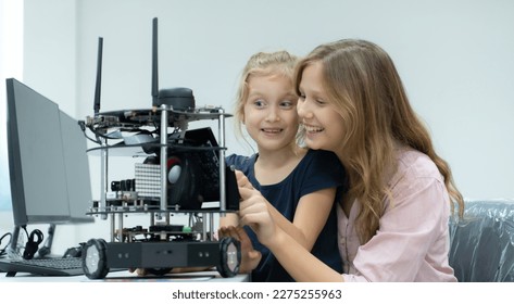 Children using the hand robot technology and having fun Learning the electronic circuit board of hand robot technology, which is one of the STEM courses.
