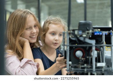 Children using the hand robot technology and having fun Learning the electronic circuit board of hand robot technology, which is one of the STEM courses.
