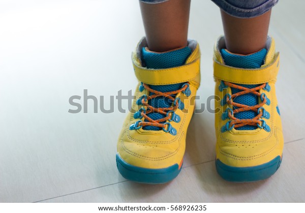 wearing yellow shoes