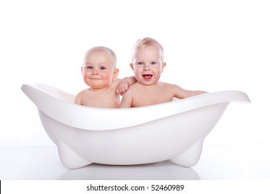 children in white bath tub on white background
