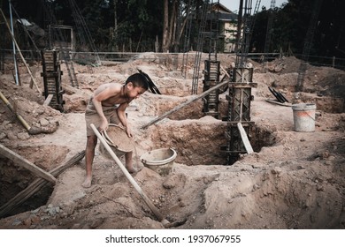 Children who work hard on the construction site, child labor , World Day Against Child Labour concept.
