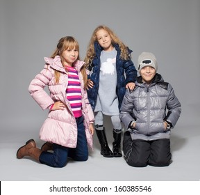 Children In Winter Clothes. Kids In Down Jackets. Fashion Child