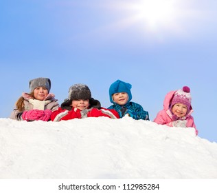 Children In Winter. Happy Kids On Snow