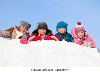 Children In Winter. Happy Kids On Snow