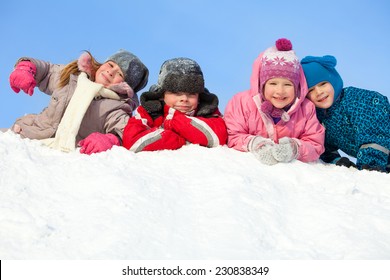 Children In Winter. Happy Kids On Snow