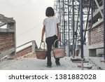 Children working at construction site for world day against child labor concept: