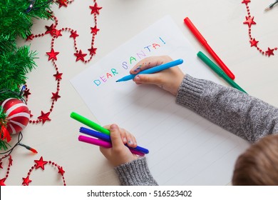 Children Writing Letter To Santa Claus At Christmas. Top View.