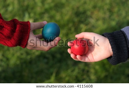 Children're giving each other easter eggs