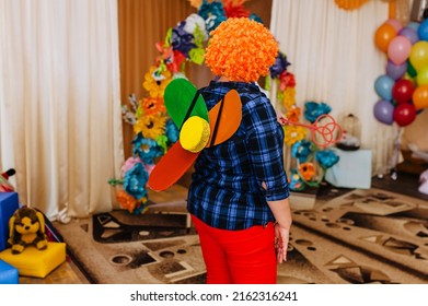 A Children's Animator In A Carlson Costume With A Propeller Indoors Entertains Children In A Kindergarten.